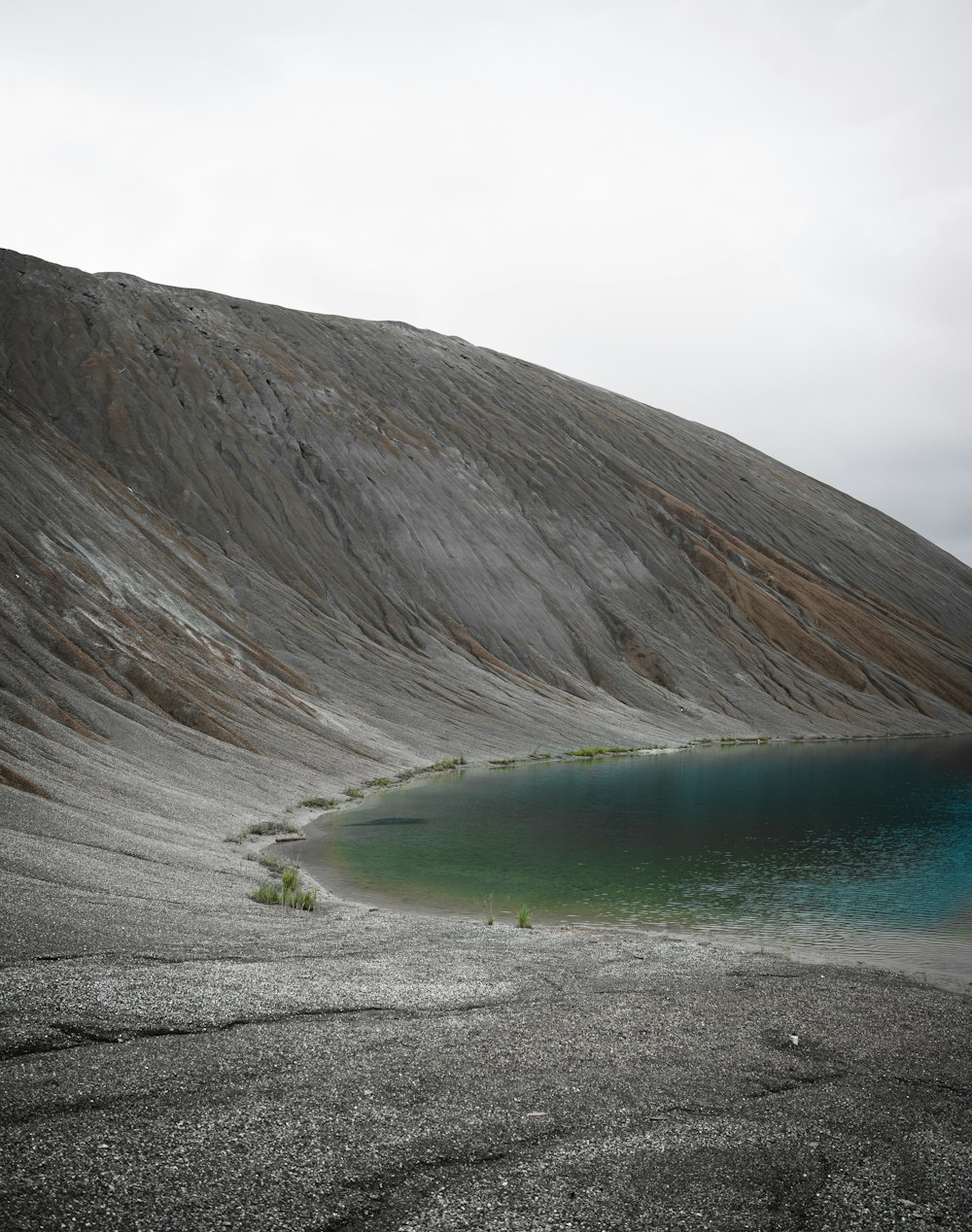 a mountain with a lake in the middle of it