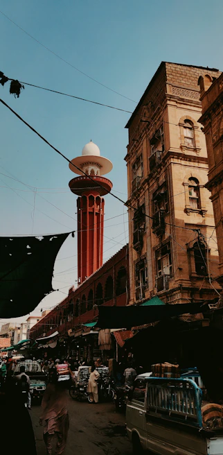 A bustling street scene in Istanbul, showcasing the blend of historic architecture and lively market stalls.