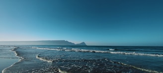 A serene coastal view of Miches with waves gently lapping at the shore.