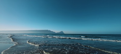 A serene landscape with gentle waves lapping at the shore.