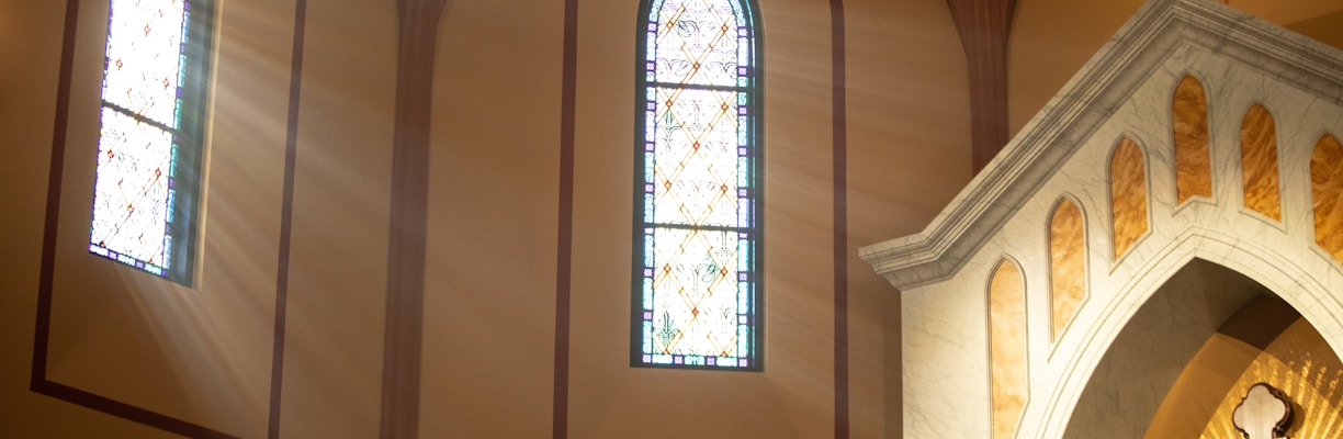 a statue of jesus on a cross in a church