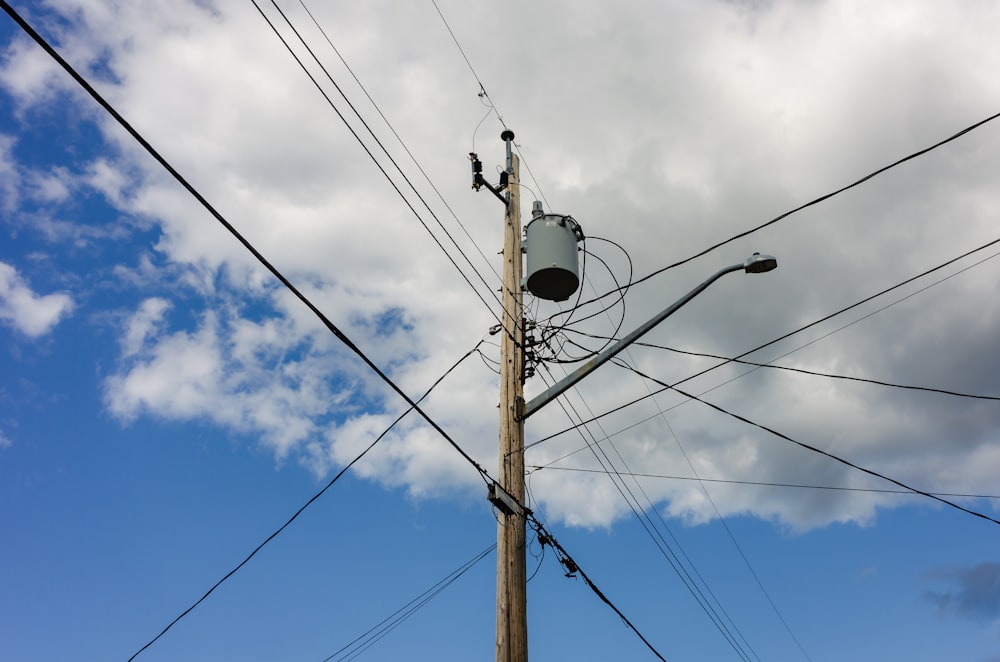 a telephone pole with a sky background