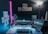 A modern workspace featuring a high-tech computer setup with glowing blue accents.