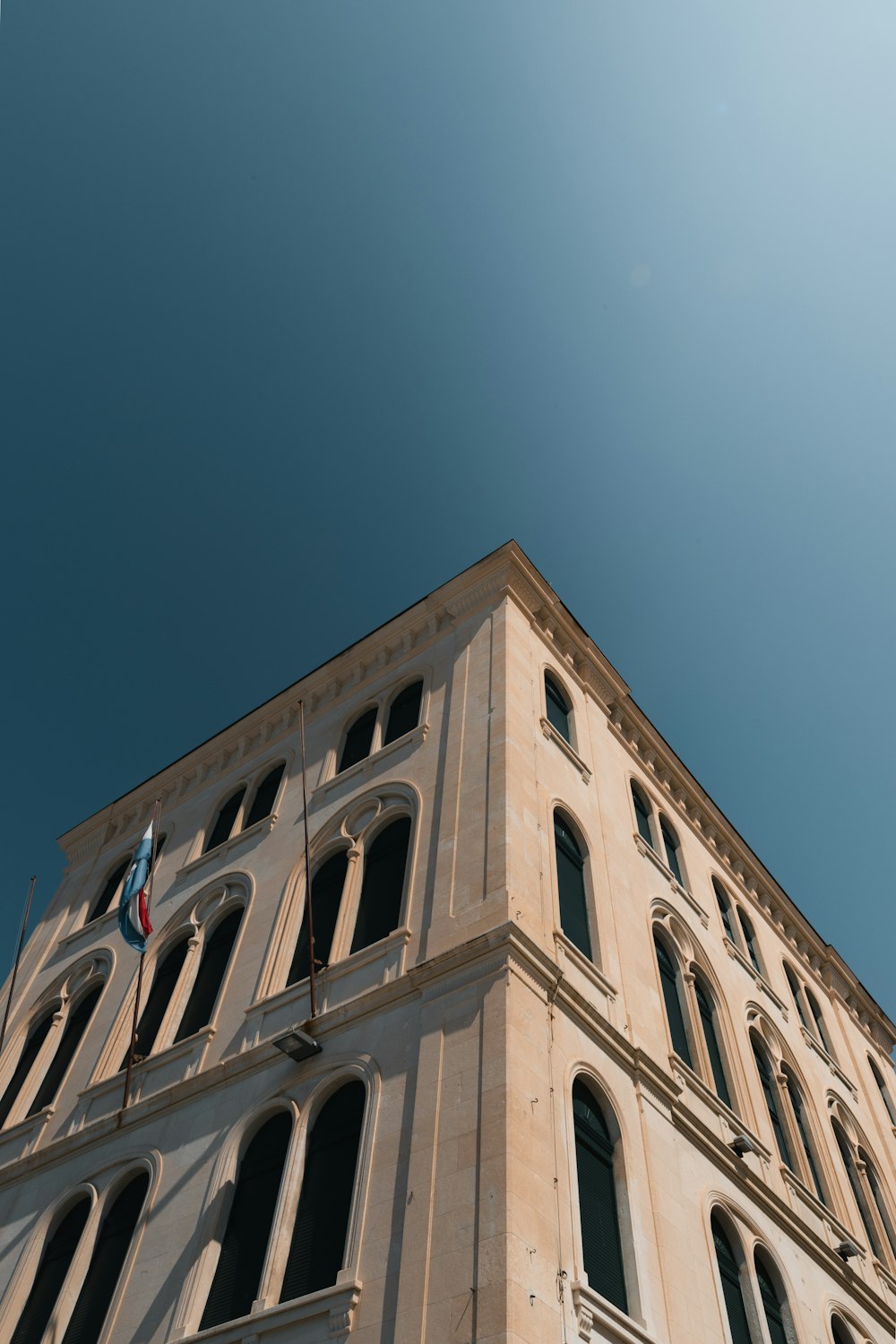 a tall building with a blue sky in the background