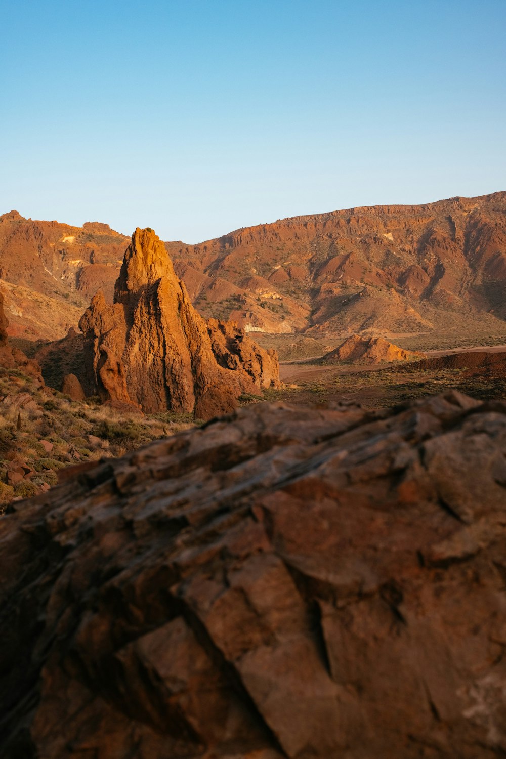 a large rock formation in the middle of a desert