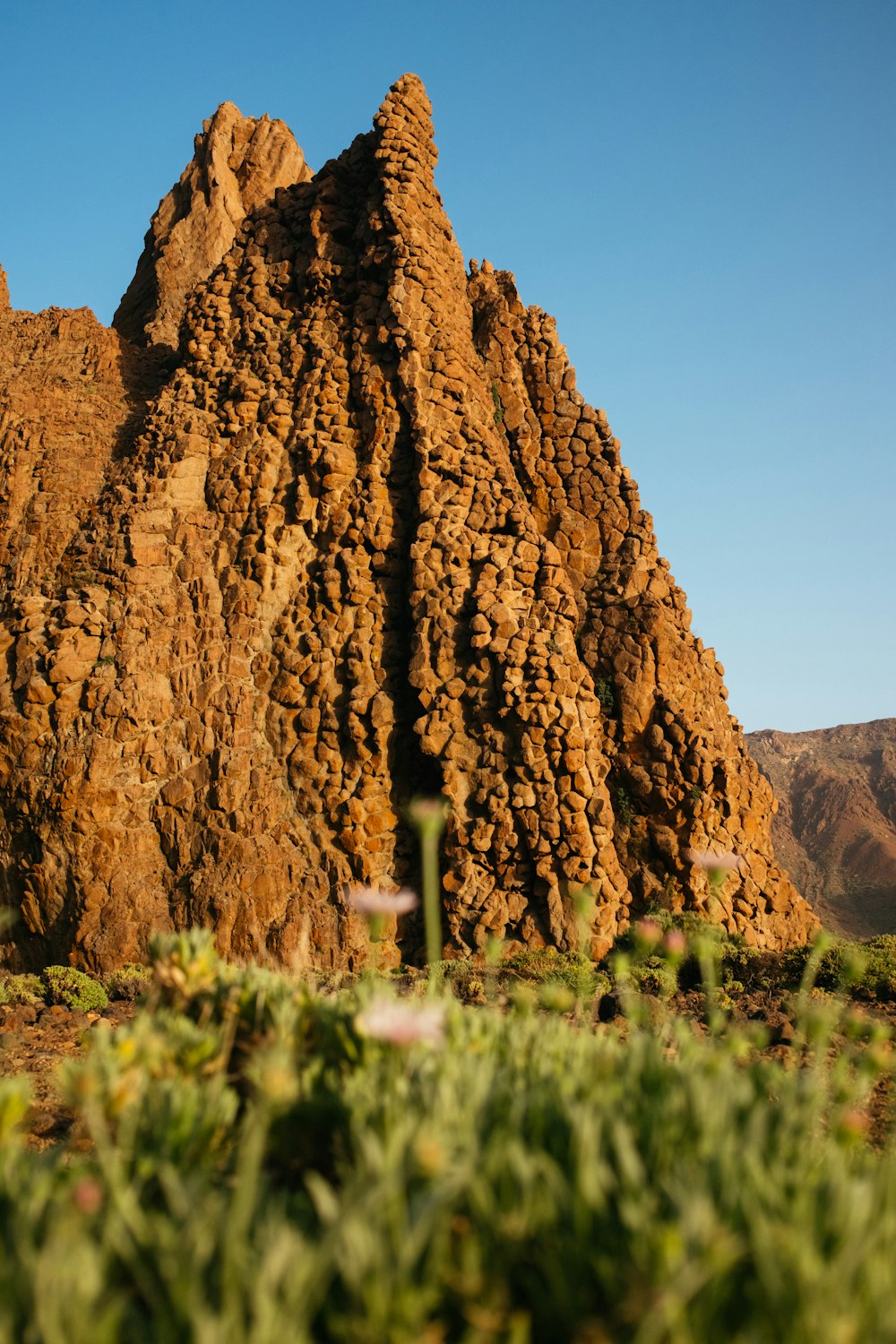 a large rock formation in the middle of a desert