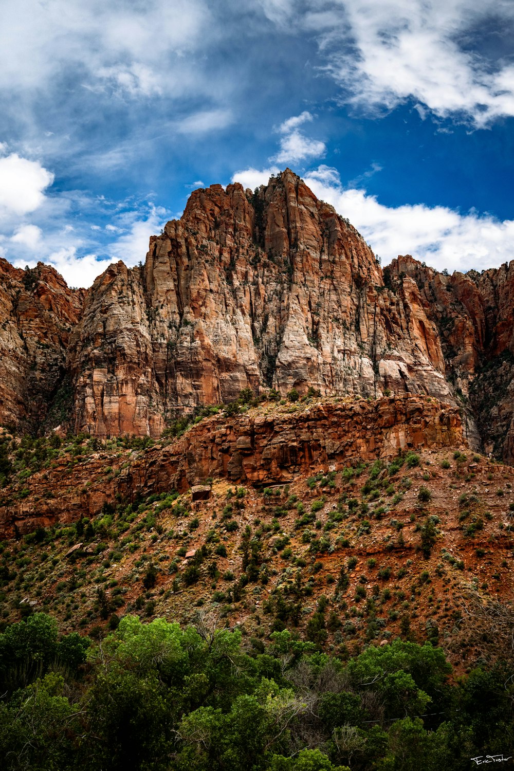 a very tall mountain with a sky in the background