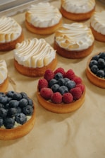 a bunch of desserts that are sitting on a table