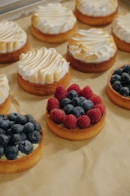 a bunch of desserts that are sitting on a table