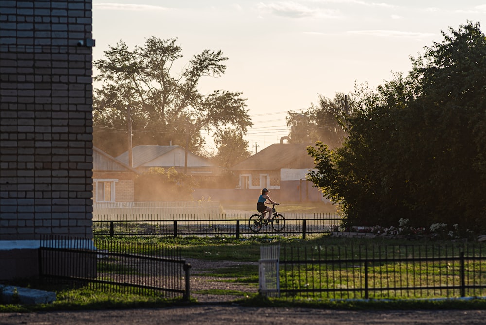 a person riding a bike in a park