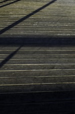 Close-up of composite decking boards with natural wood texture and orange accents.