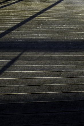 A skilled carpenter working on a wooden deck.