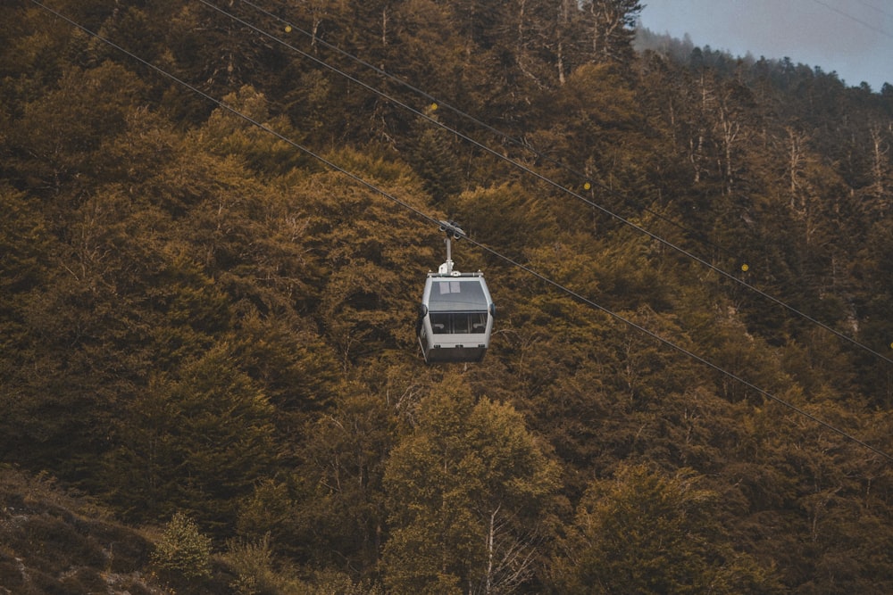 a cable car going up the side of a mountain