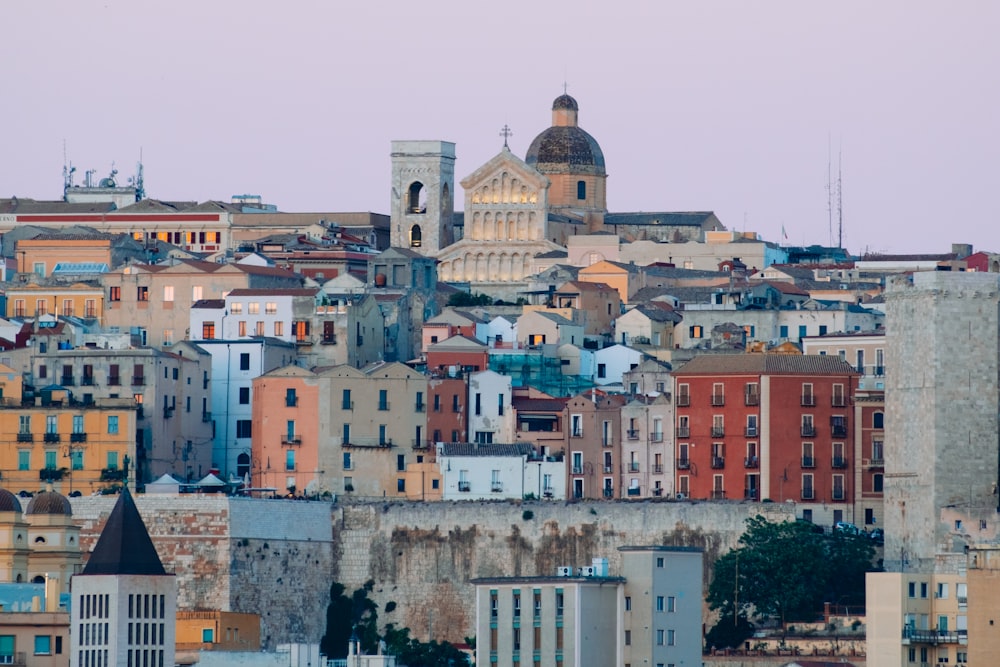 a city with a lot of buildings and a clock tower