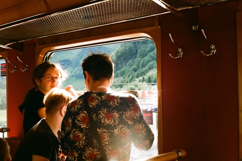 Travelers enjoying sea view train