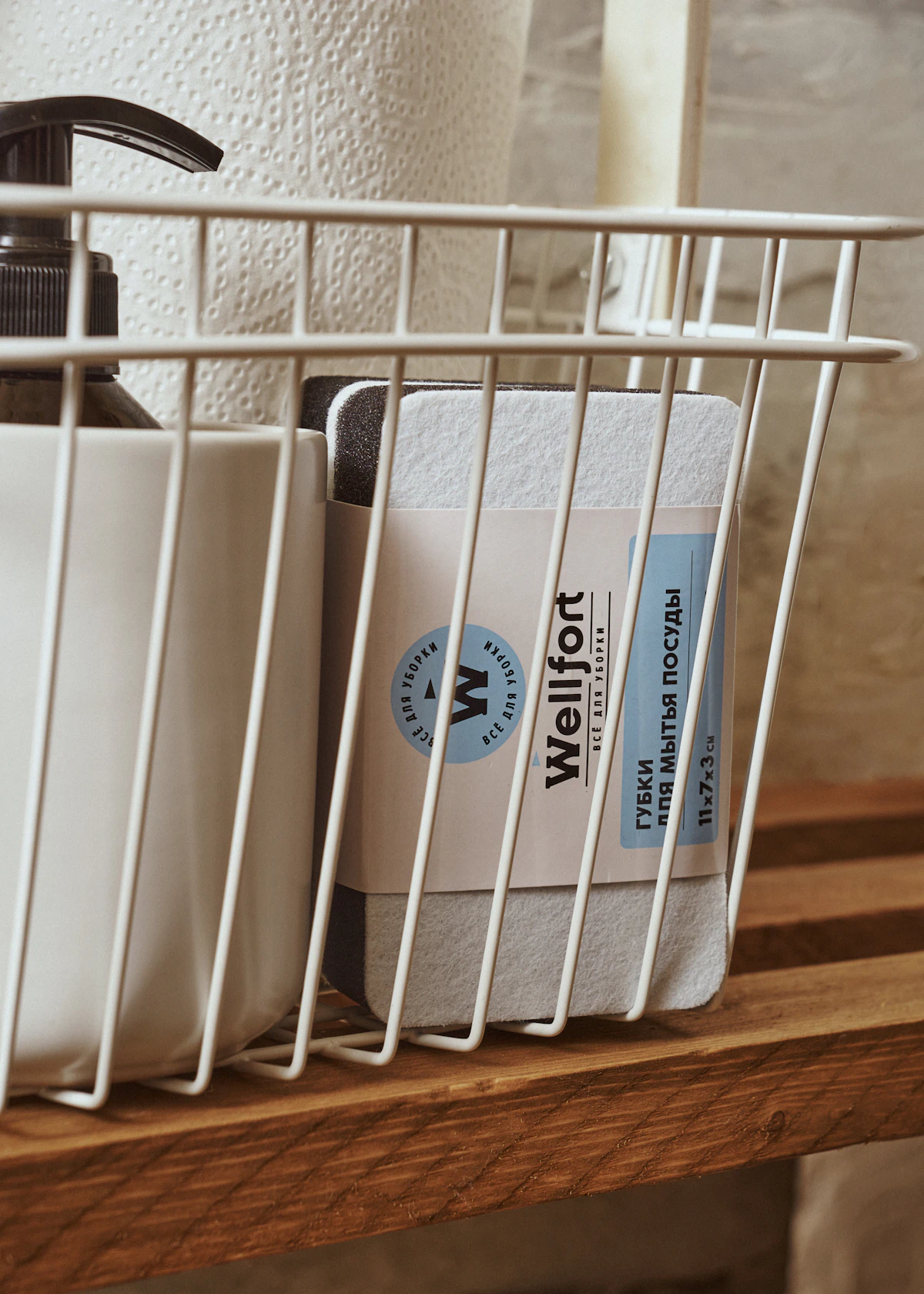 Labelled baskets organising toiletries in a small bathroom