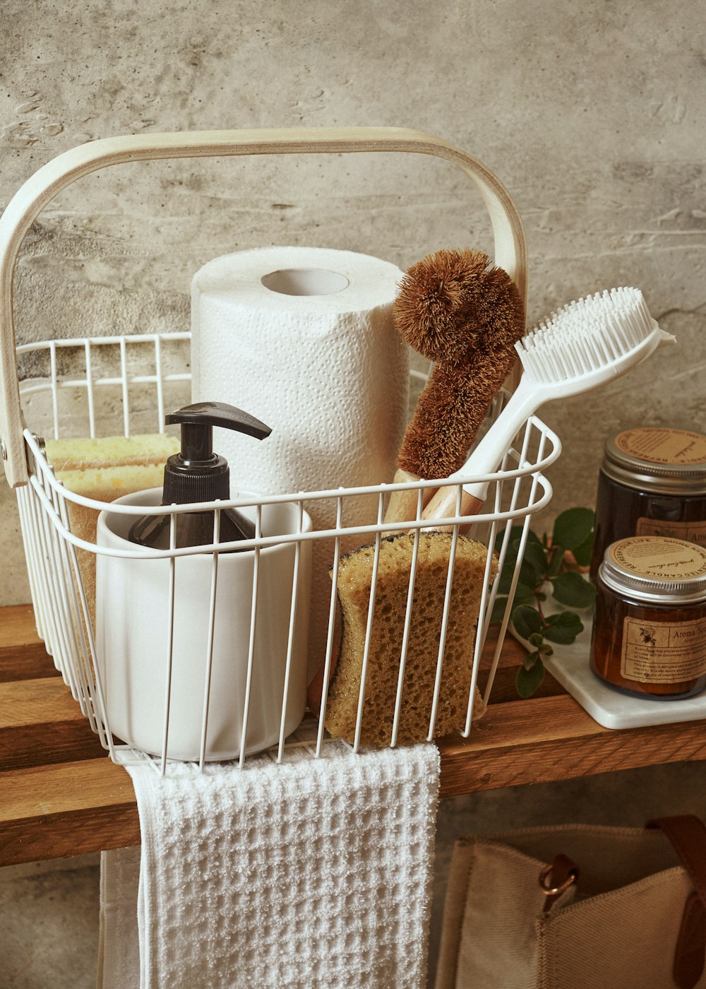 a white basket filled with lots of bathroom items
