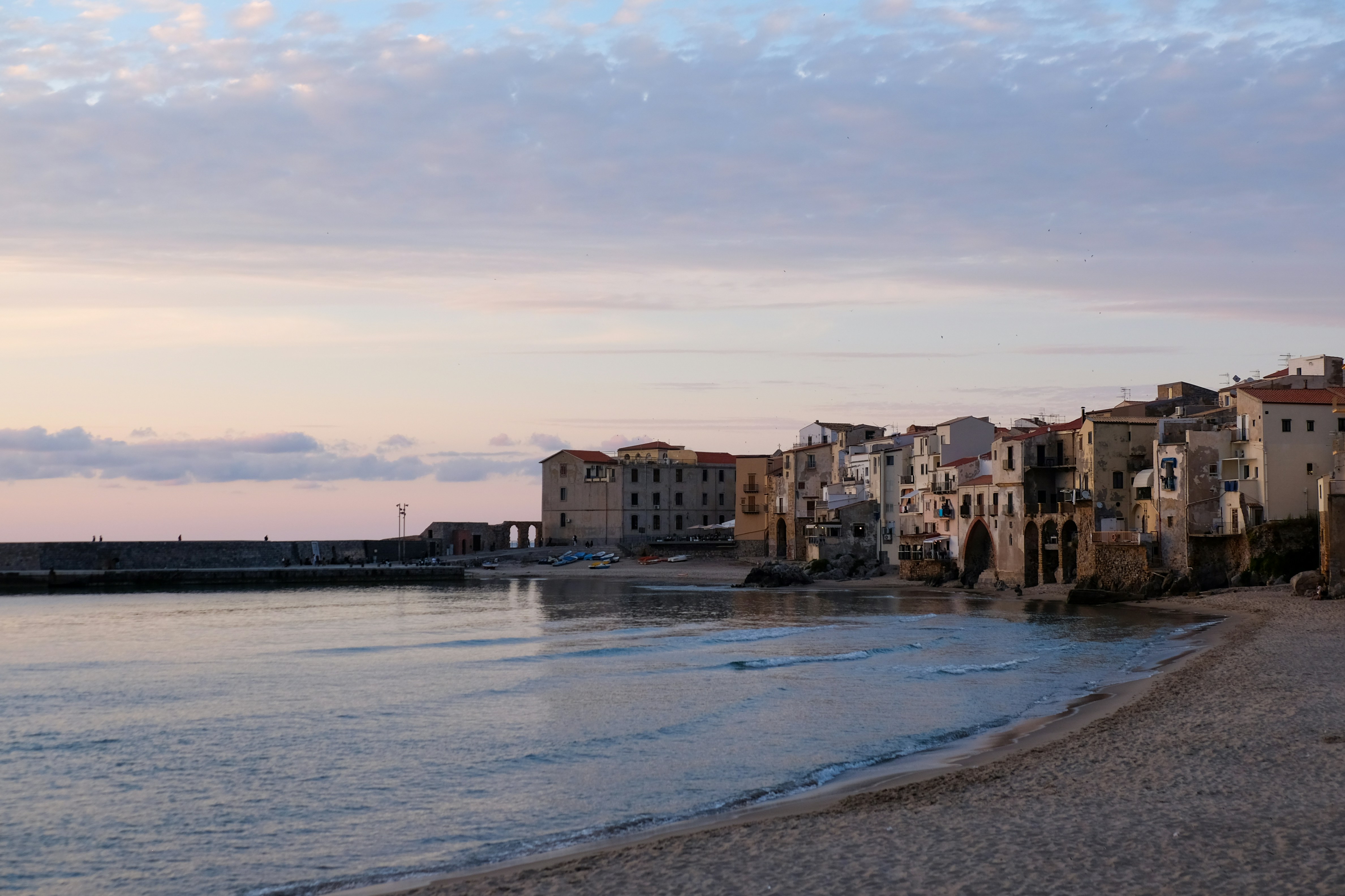 Enchanting Cefalù: A Captivating Cityscape Unveiled Under the Golden Hues of the Setting Sun