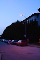 A peaceful neighborhood watch group walking together at dusk.