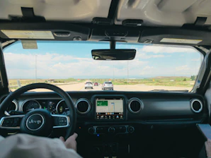 a man driving a truck on a highway