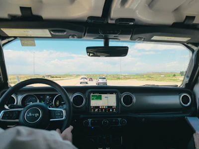 a man driving a truck on a highway