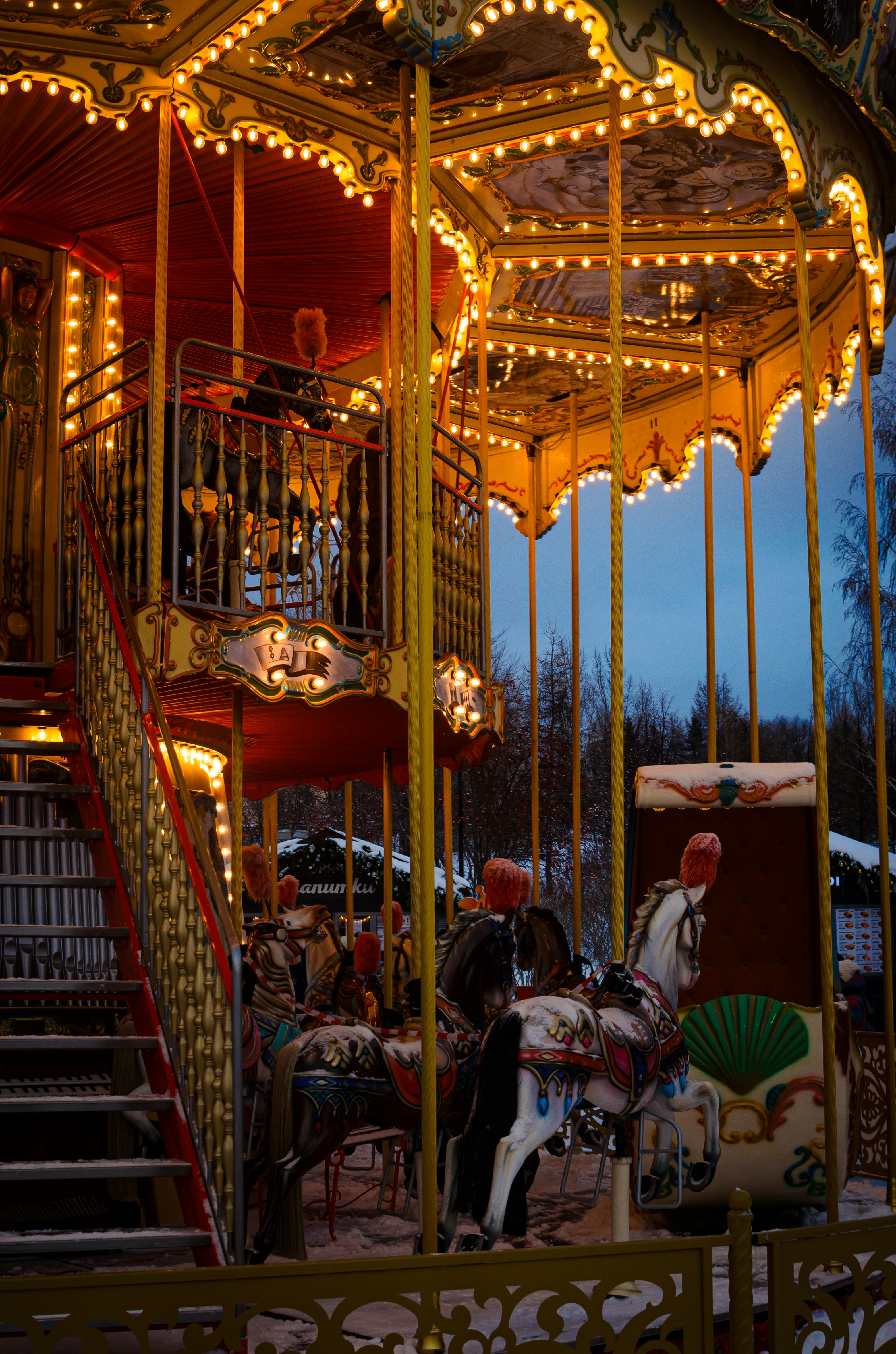 a merry go round with lights and a carousel