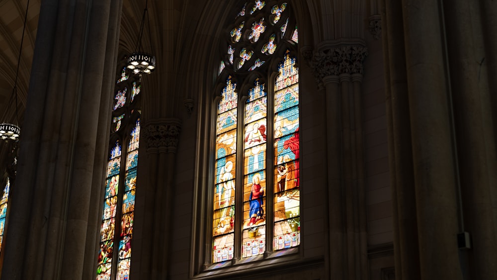 a couple of stained glass windows in a church