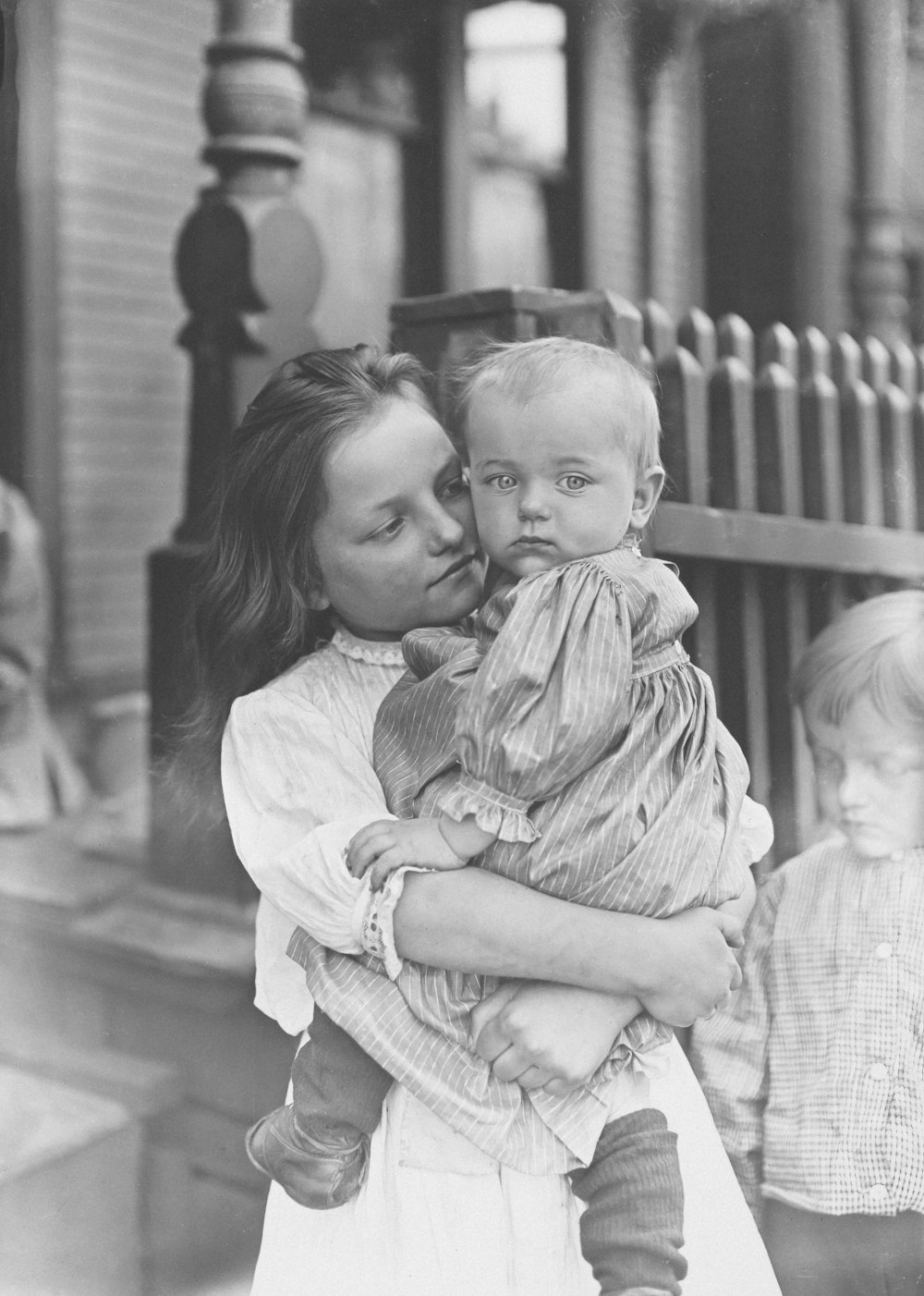 a woman holding a baby in her arms