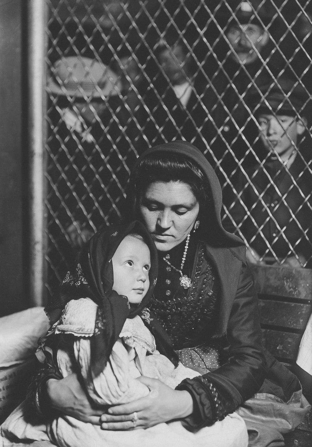 an old photo of a woman holding a doll