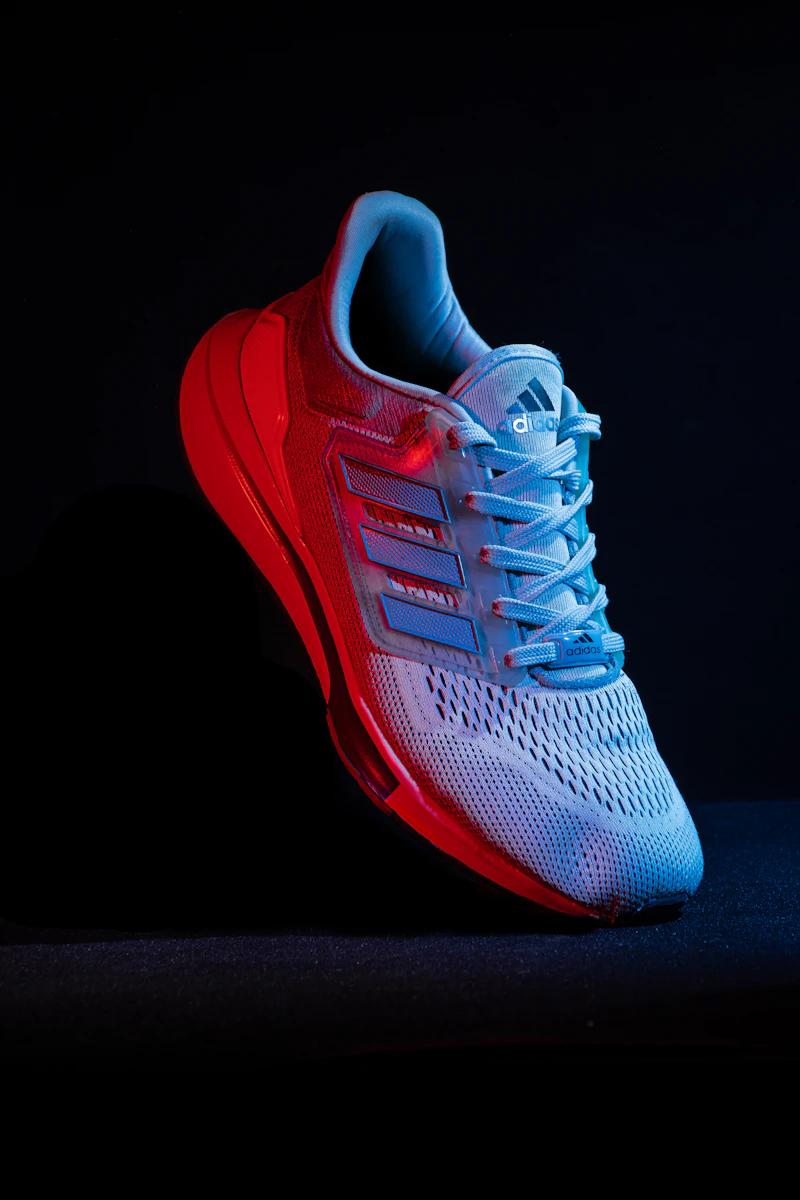 Adidas blue running sneaker with signature three stripes