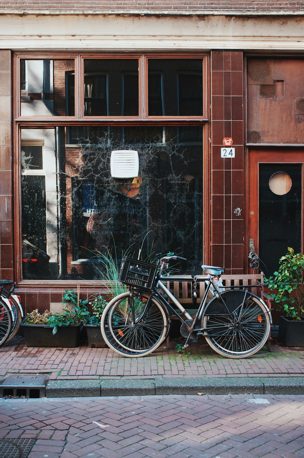 a couple of bikes parked next to each other in front of a building