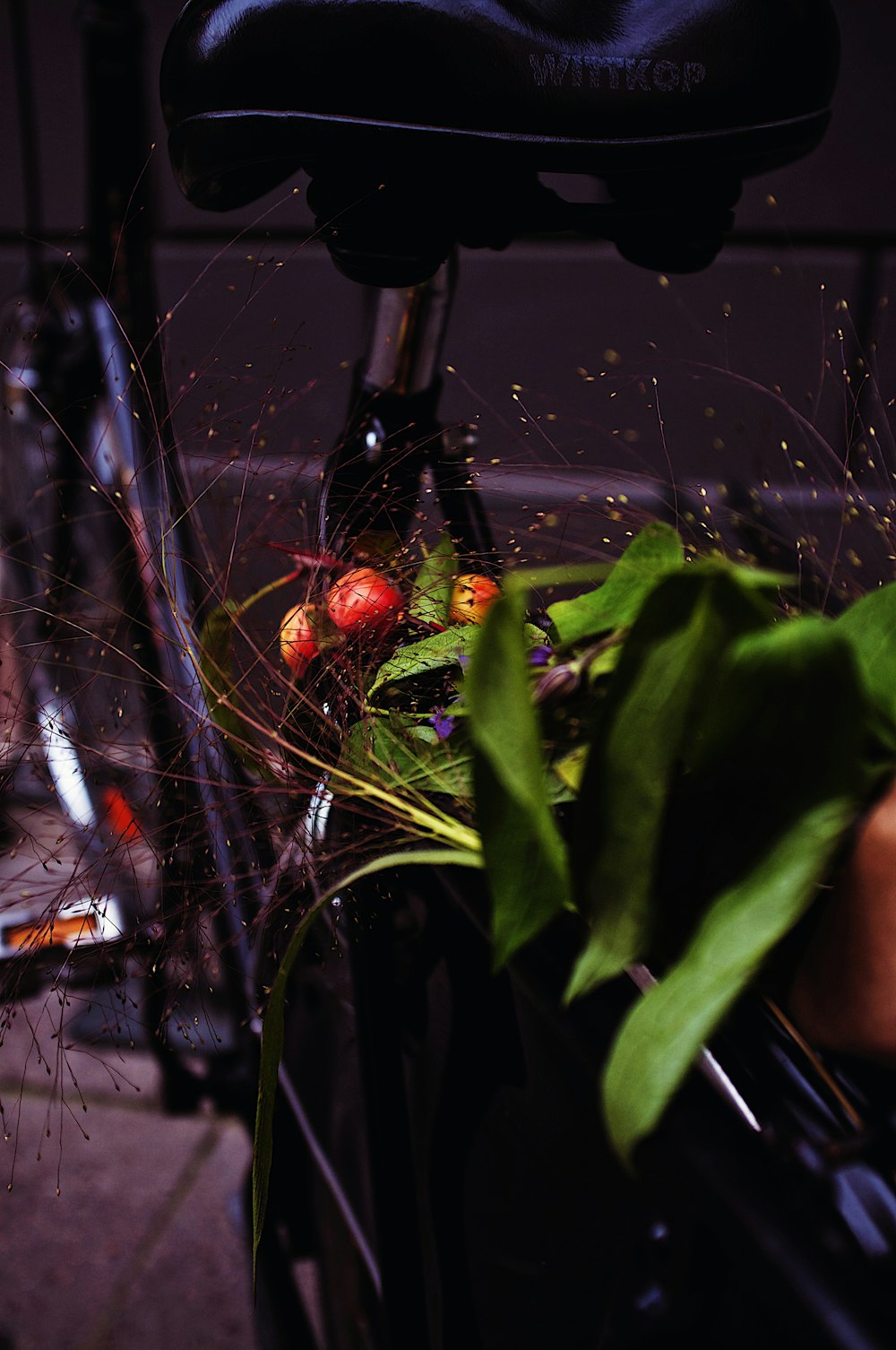 a close up of a bicycle with a bunch of flowers