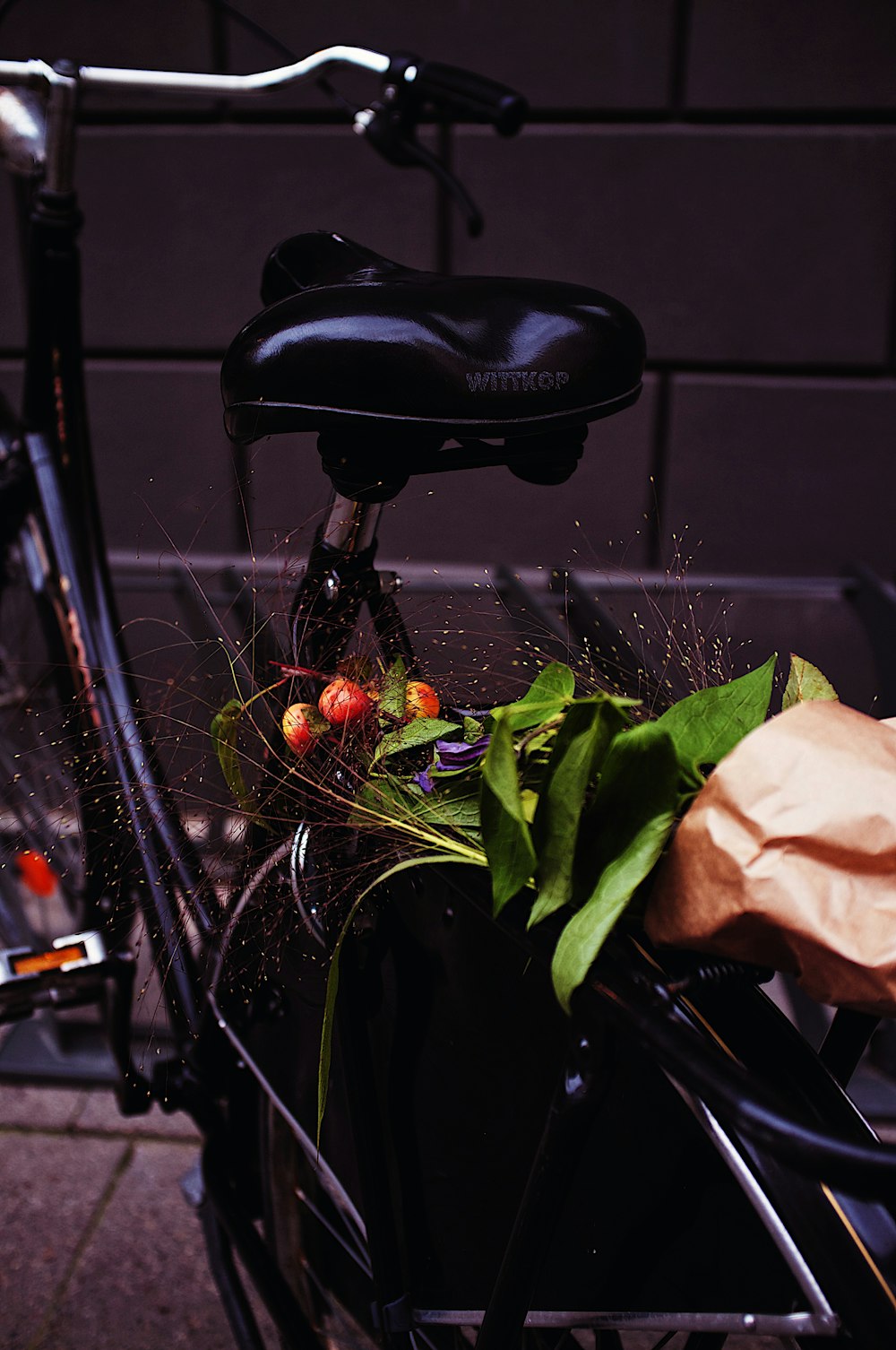 a close up of a bicycle with a bag on the back