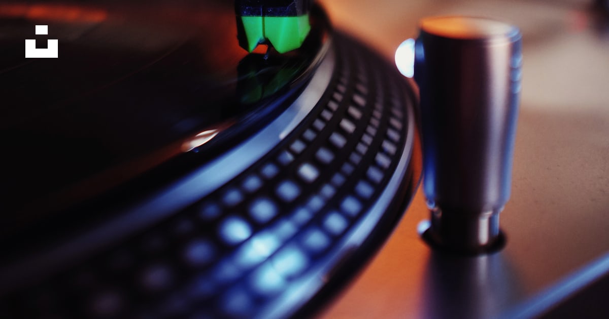 A turntable with a cup on top of it photo – Free Lp Image on Unsplash