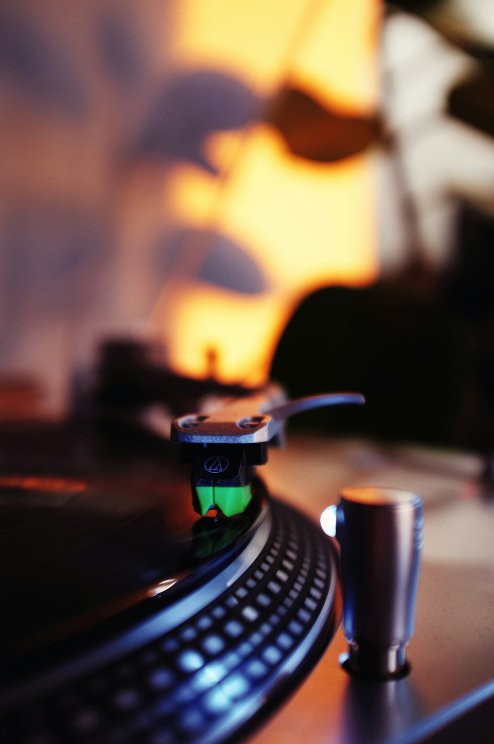 a turntable with a cup on top of it