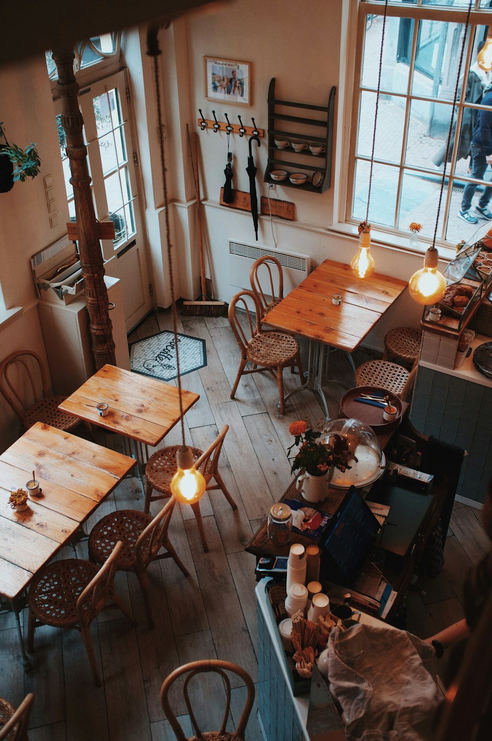 an overhead view of a restaurant with wooden tables and chairs