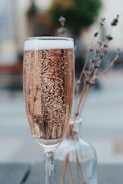 Close-up of a chilled glass of sparkling non-alcoholic wine with fresh grapes