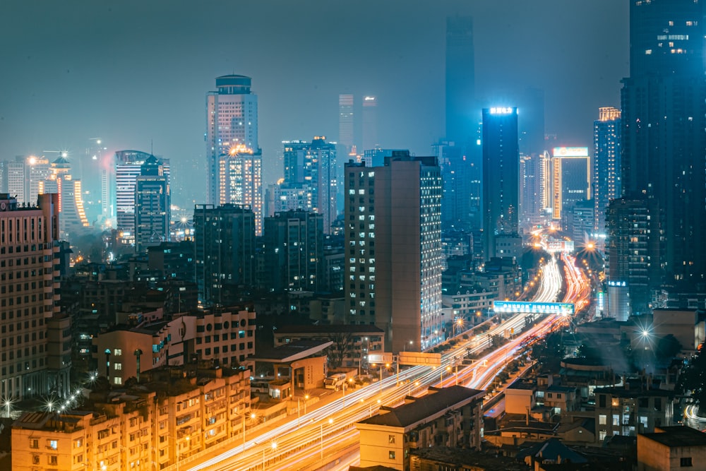 a city at night with a lot of tall buildings