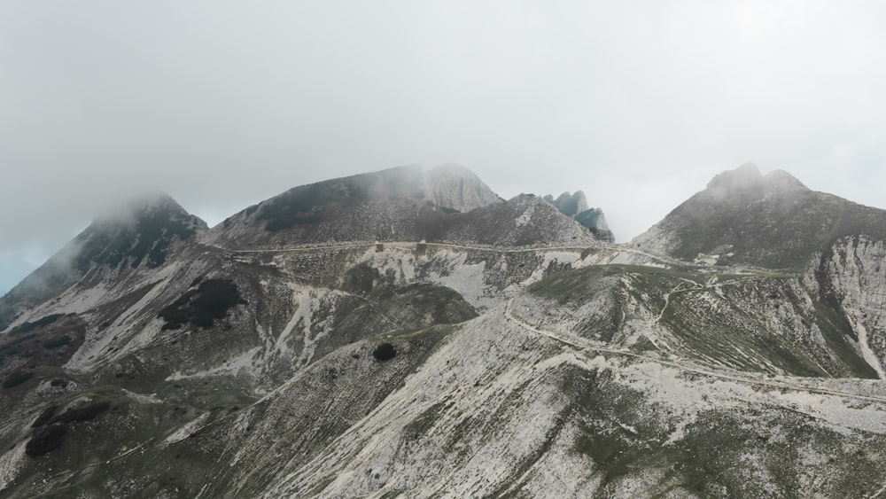 a very tall mountain with a road going through it