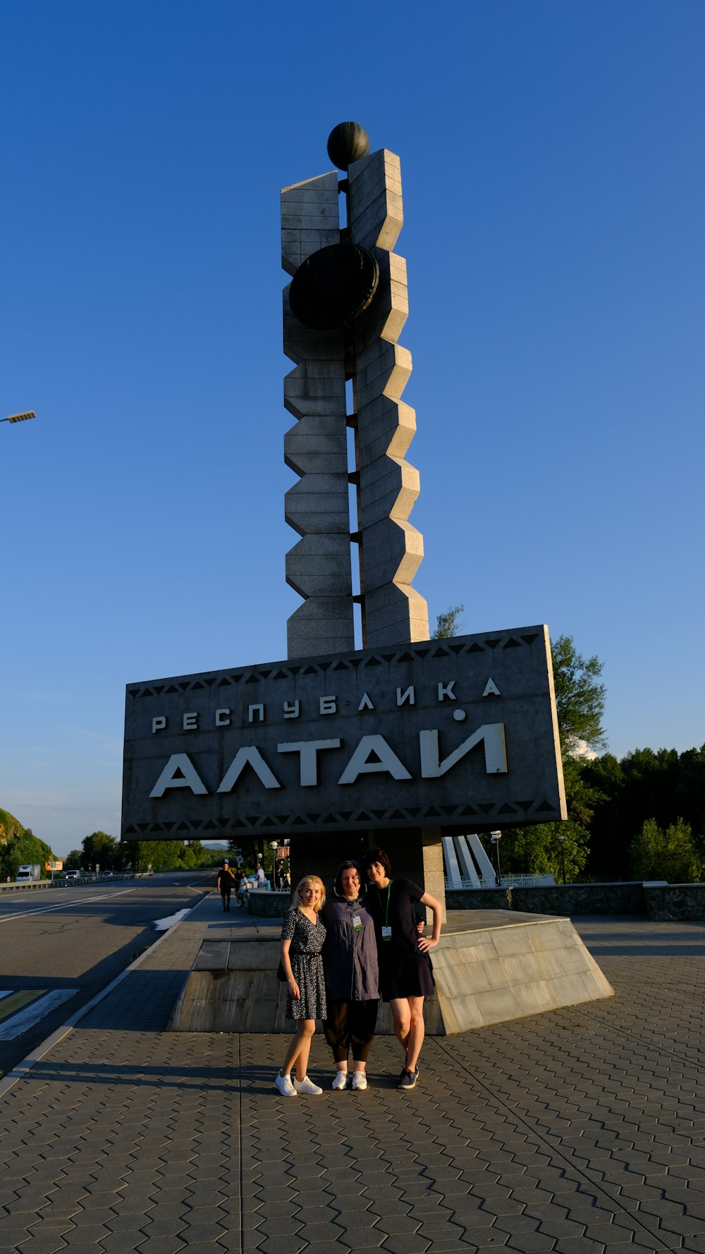 a group of people standing in front of a sign