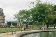 A serene park setting with children listening to a storyteller.