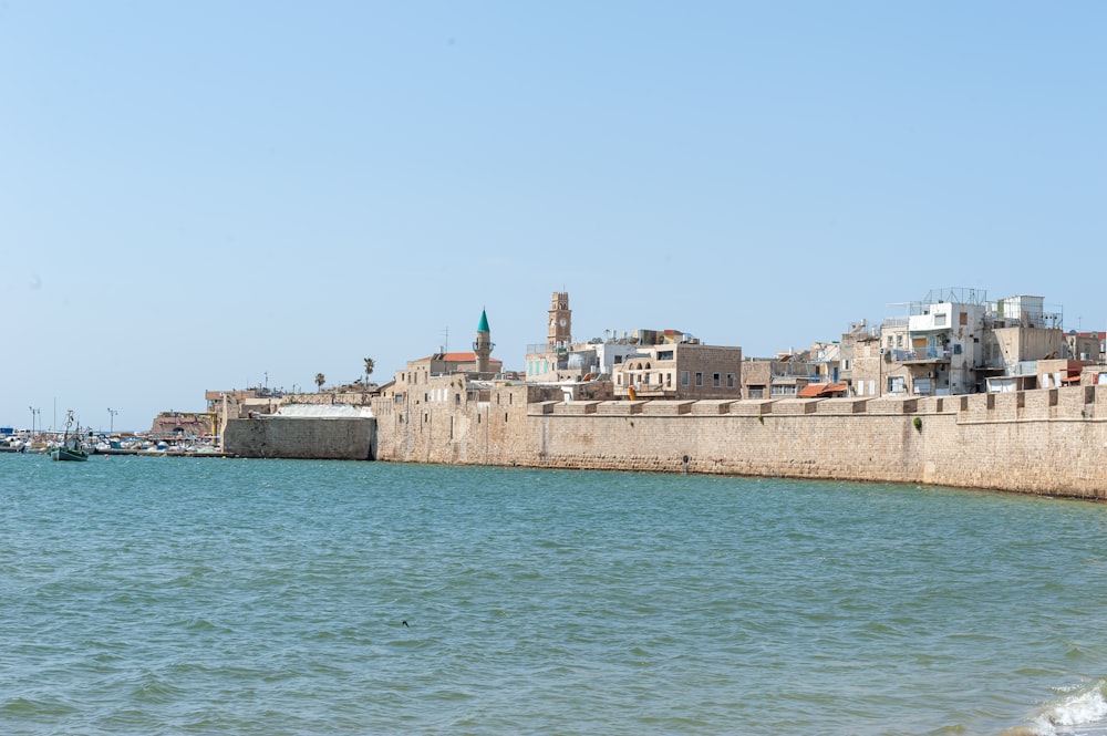 a large body of water with a city in the background