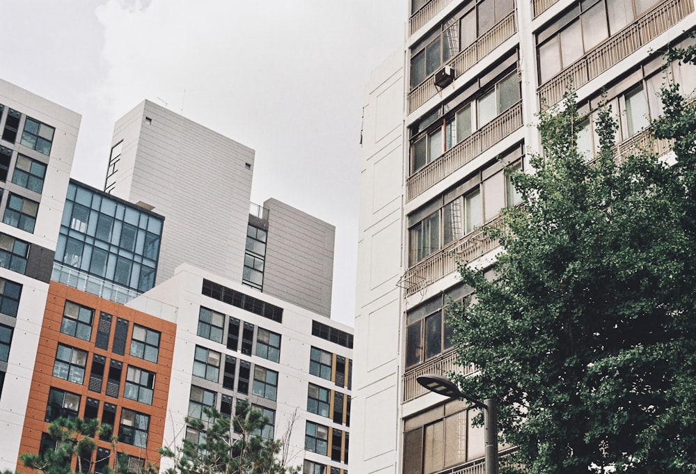 a couple of tall buildings sitting next to each other