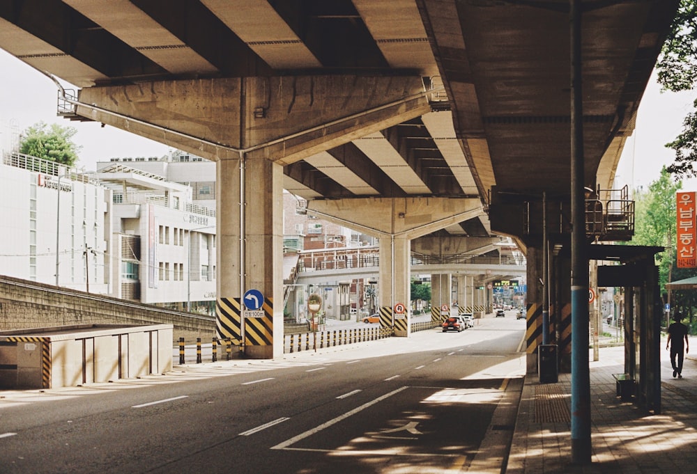 a view of a street under a bridge