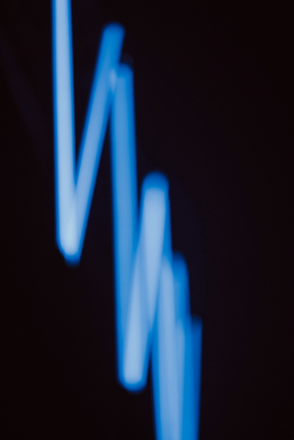 a blurry photo of a blue object in the dark