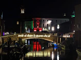 Night view of the Porto Antico in Genoa, symbolizing local inspiration.