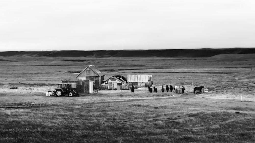 a black and white photo of a farm