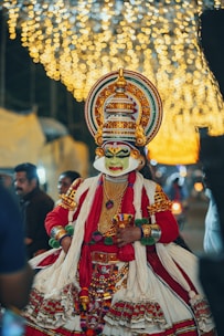 a man dressed in a costume and headdress