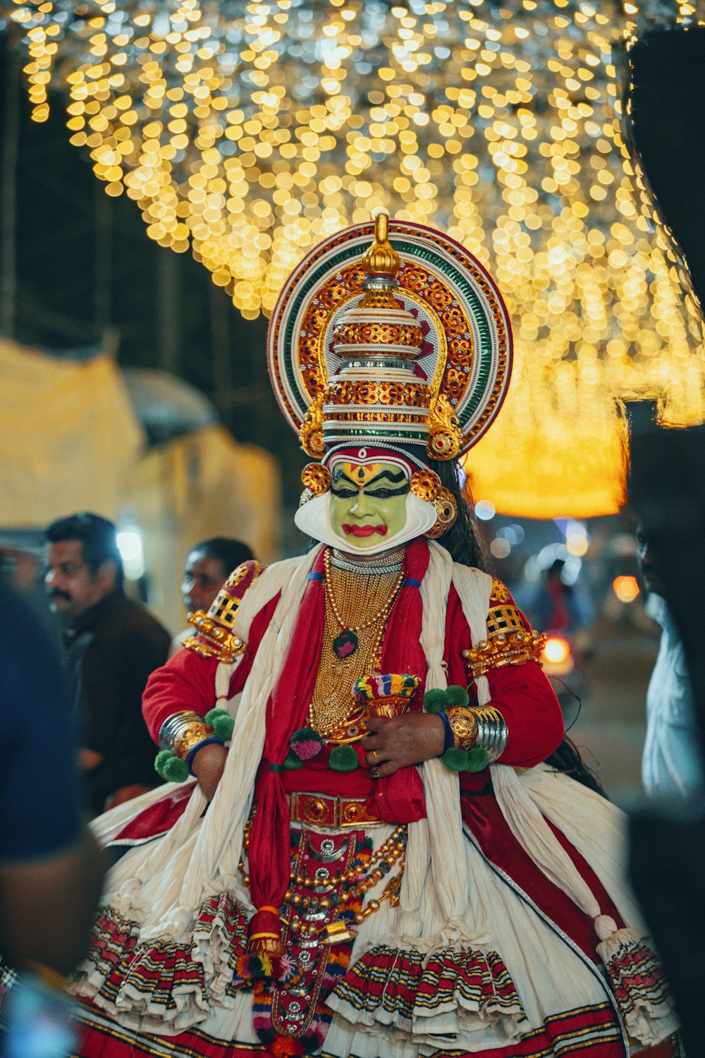 a man dressed in a costume and headdress