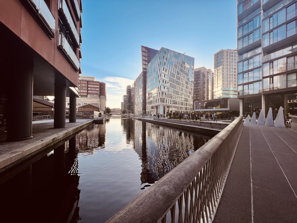 a river running through a city next to tall buildings